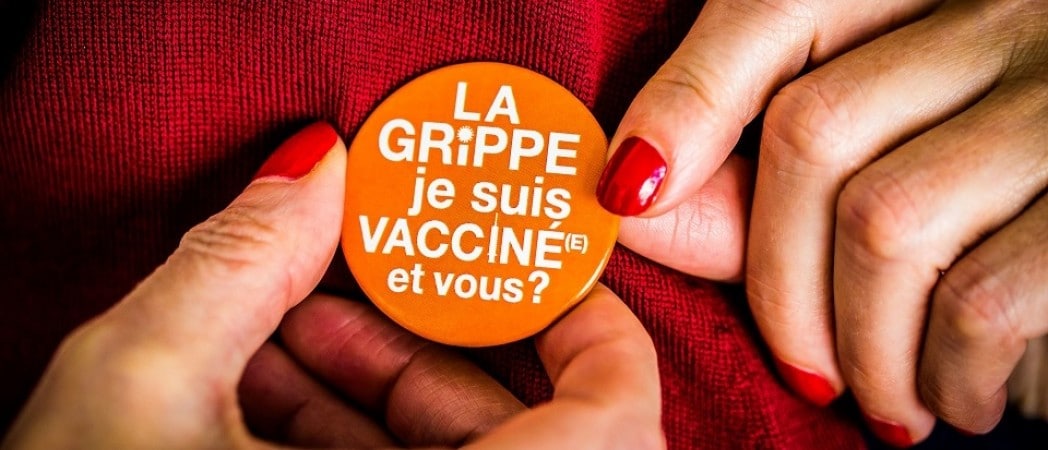 Photo d'un badge portant la mention : la grippe, je suis vacciné(e) et vous ?